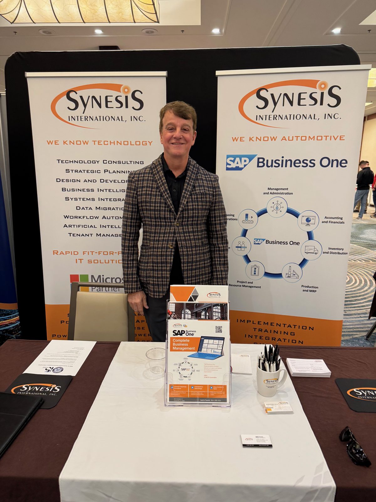 Synesis International booth at the 2026 SC Automotive Summit featuring SAP Business One and manufacturing solutions